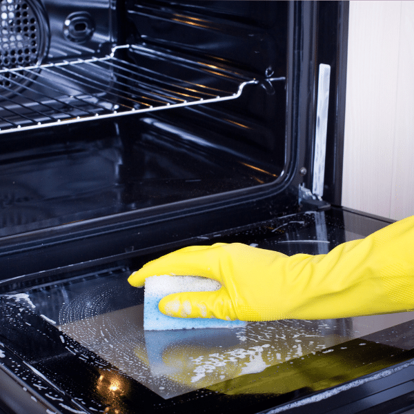 Deep cleaning of a kitchen oven during residential deep cleaning service